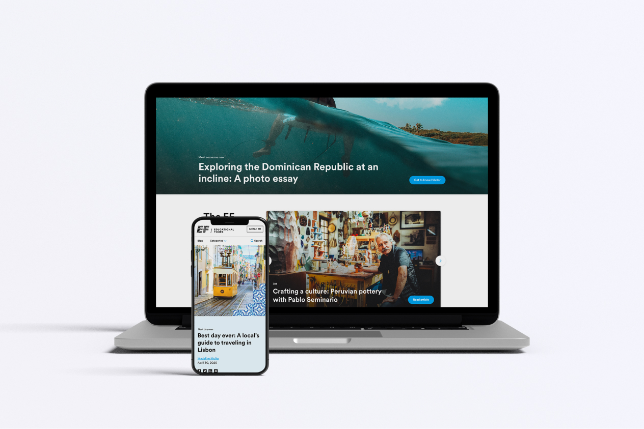 Laptop and smartphone displaying articles including a photo essay and travel guide on their screens against a white background